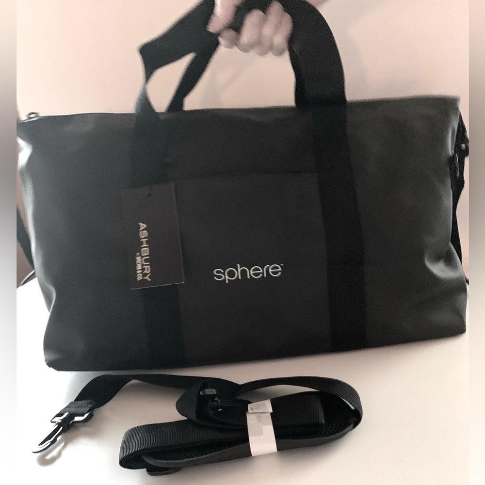 Duffel Bag NEW Black with shoulder strap.Front pocket. mesh pocket inside.
